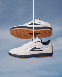 Skater wearing Lakai Cambridge XLK skate shoes in White Suede Navy Gum