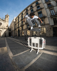 Skater wearing Lakai Cambridge XLK skate shoes in White Suede Navy Gum