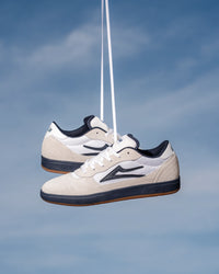 Skater wearing Lakai Cambridge XLK skate shoes in White Suede Navy Gum