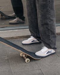 Skater wearing Lakai Cambridge XLK skate shoes in White Suede Navy Gum