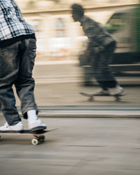 Skater wearing Lakai Cambridge XLK skate shoes in White Suede Navy Gum