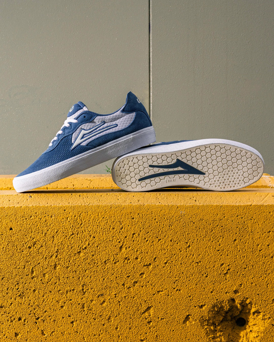 Skater wearing Lakai Essex skate shoes in Light Navy Suede White