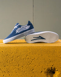 Skater wearing Lakai Essex skate shoes in Light Navy Suede White