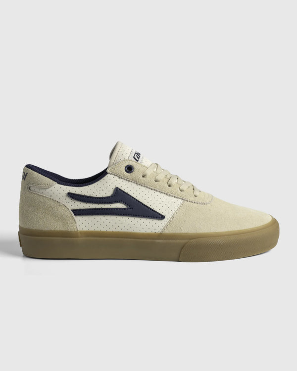 Lakai Manchester Elite skate shoe in Whisper White Suede Navy, side profile