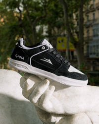Skater wearing Lakai Telford Low Chris Joslin skate shoes in Black White