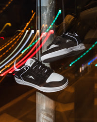 Skater wearing Lakai Telford Low Chris Joslin skate shoes in Black White
