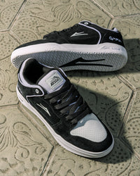 Skater wearing Lakai Telford Low Chris Joslin skate shoes in Black White