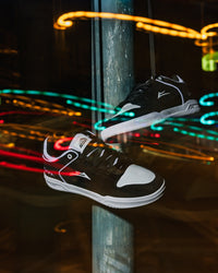 Skater wearing Lakai Telford Low Chris Joslin skate shoes in Black White