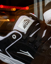 Skater wearing Lakai Telford Low Chris Joslin skate shoes in Black White